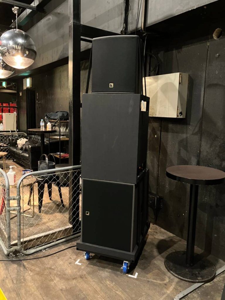 Two stacks of one L-Acoustics X12 point source speaker and two SB18 subwoofers provide rear-fill dance floor coverage.