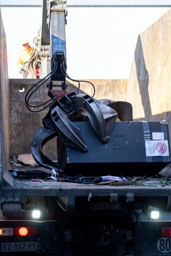 Initial steps of the recycling process for counterfeit L-Acoustics products, ensuring proper dismantling and sorting