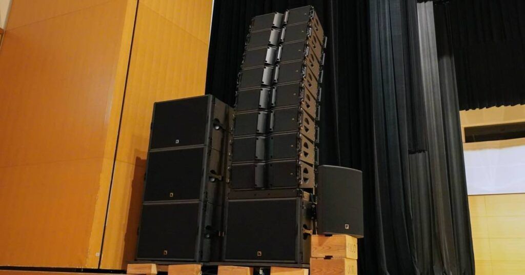 Osaka International Convention Center Main Hall mobile professional sound system of eight L-Acoustics Kara II and four SB18 subwoofers on each side of the stage, with an X15 HiQ for in-fill