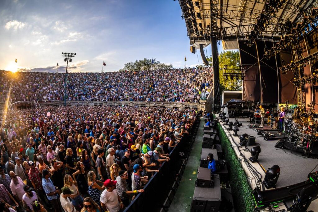 L-Acoustics KS28 subs topped with Kara II concert sound system front-fills line the face of the stage at NYC’s Forest Hills Stadium (photo credit: Alive Coverage)