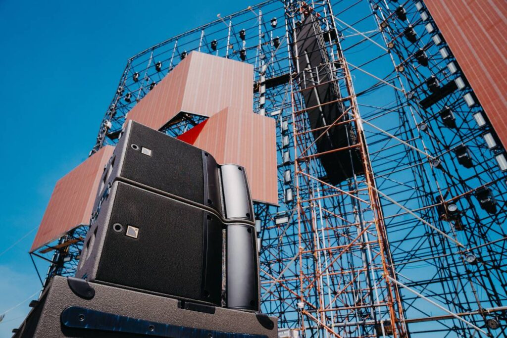 The main professional sound system configuration showcases L-Acoustics K1-SB subwoofers, twelve K1 line array elements, and K2 enclosures, with A10 Focus front-fill ensuring consistent coverage across all audience areas