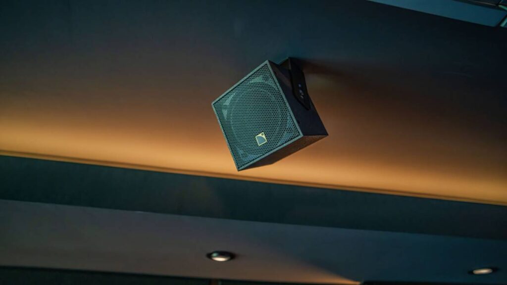 Four L-Acoustics X4i height speakers positioned for immersive 9.1.4 Dolby Atmos configuration.