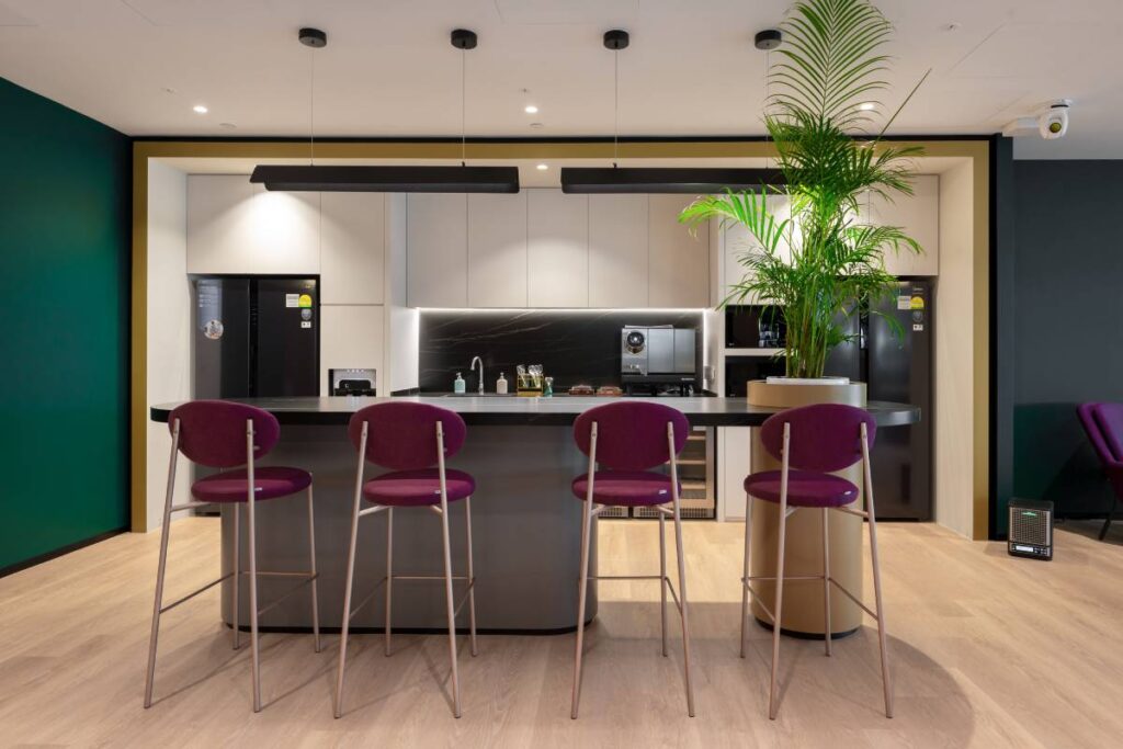 The kitchen and bar section of the Gravity Point, where team members can convene for breaks, lunch, and informal interaction at the new APAC Headquarters - © L-Acoustics / Lin Yu Fang