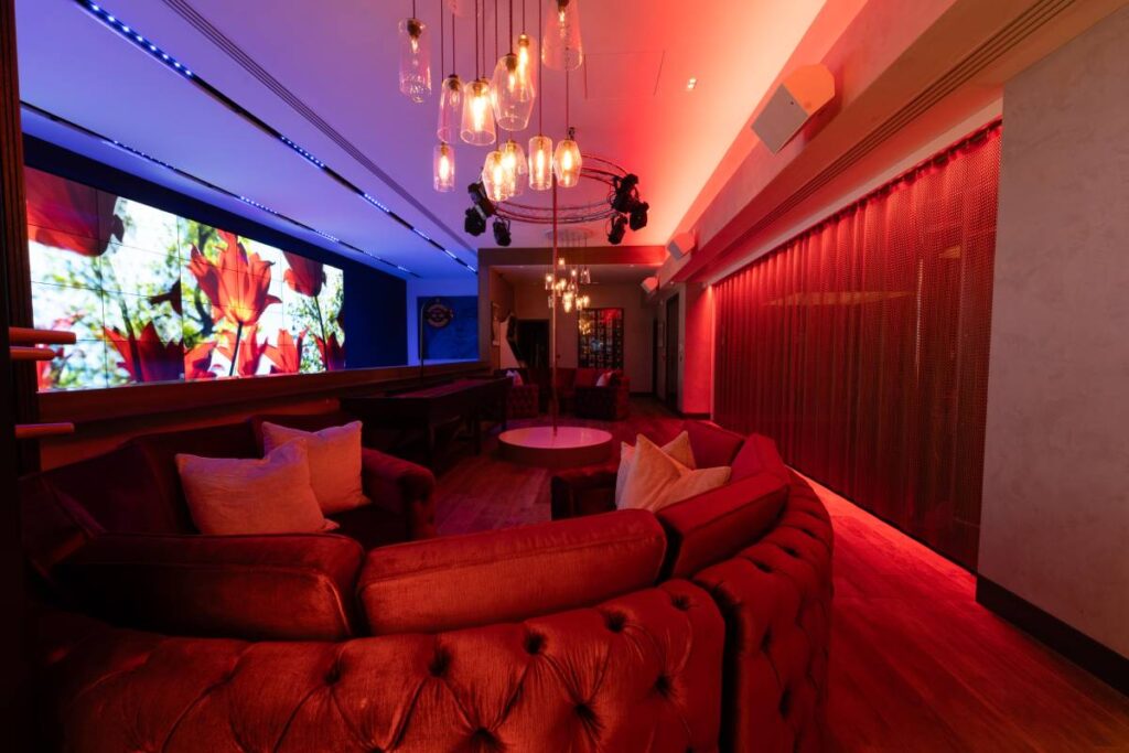 A dance floor zone designed for high-energy entertainment is central to the room.