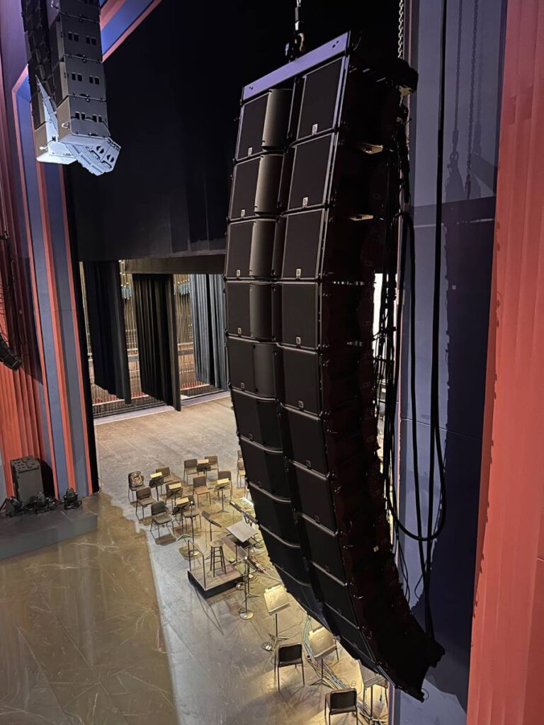 The venue’s house-right L-Acoustics K3 loudspeaker array, with the Kara II center array and KS21 sub hangs seen in the background