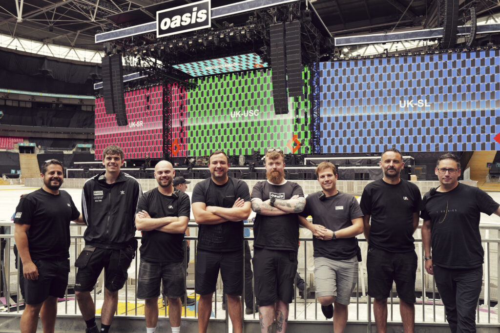 Part of the Oasis Live ’25 tour audio crew, with Brit Row’s L-Acoustics PA flown in the background (photo credit: James Mitcham)
