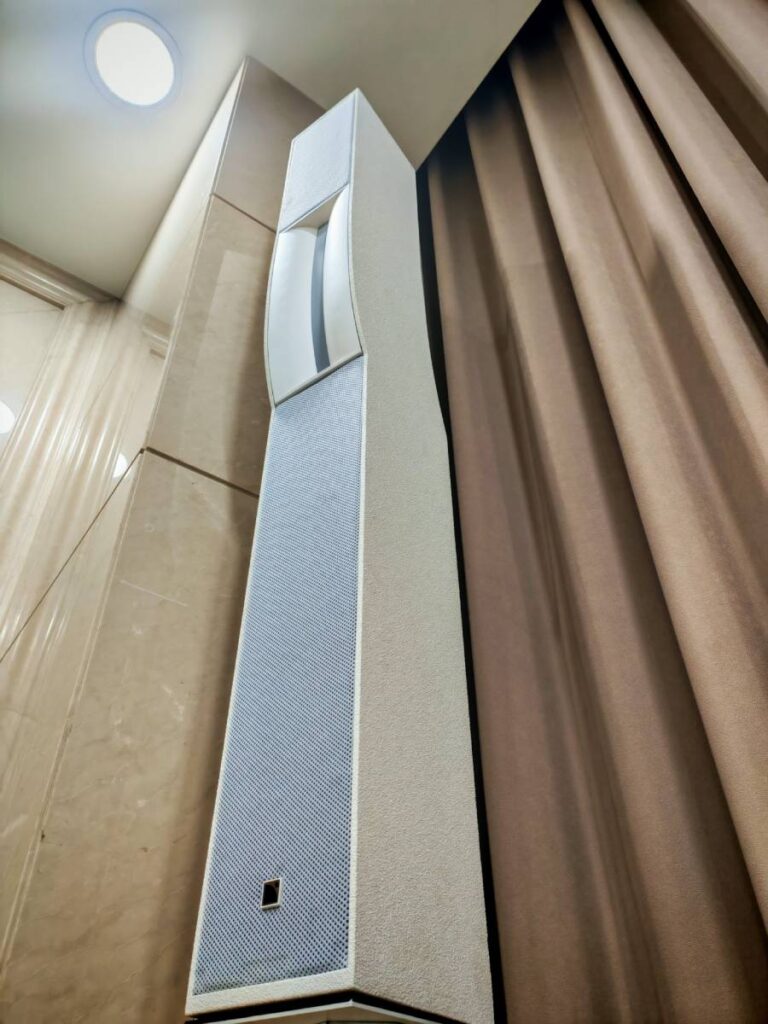 The L-Acoustics Syva were customised in white to complement the conference room's beige marble interior