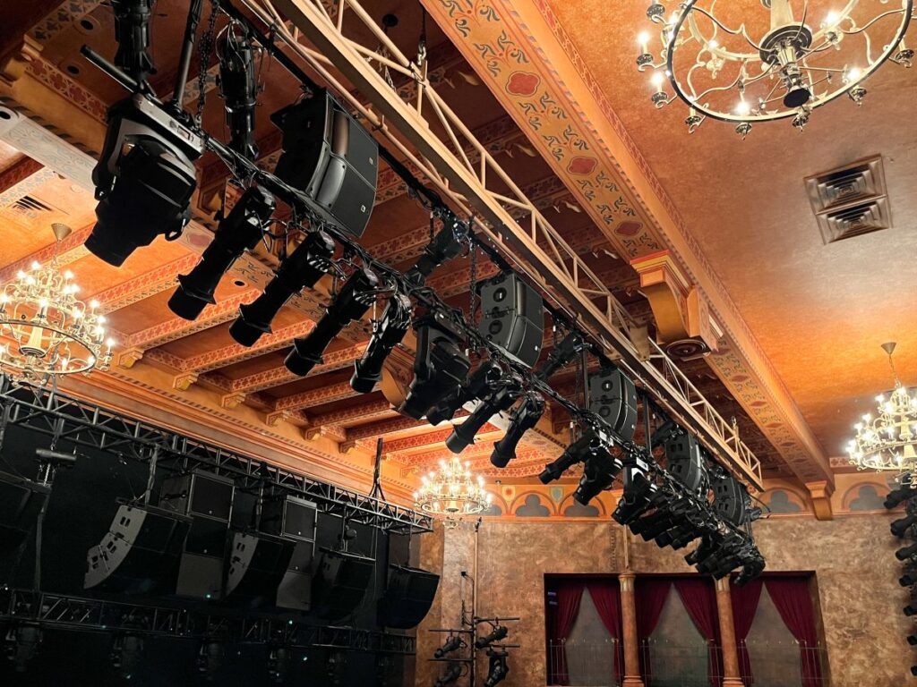 A second tier of five more L-Acoustics A Series arrays, each made up of one A10 Focus over one A10 Wide, provide spatial delays to the front mezzanine