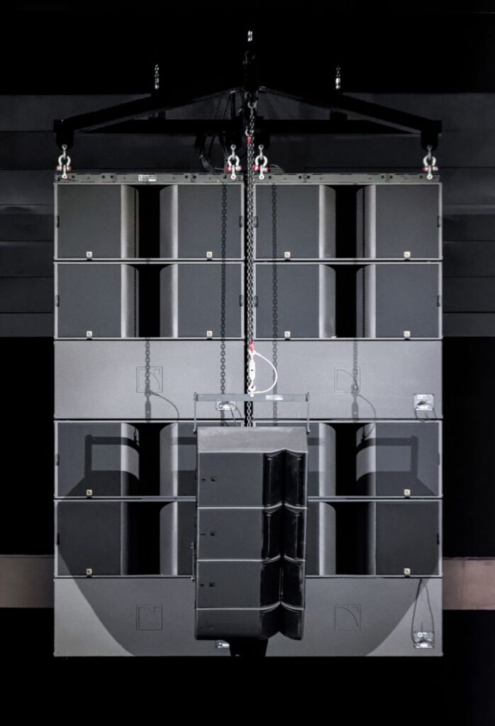 Twelve L-Acoustics KS28 are flown centrally above the stage
