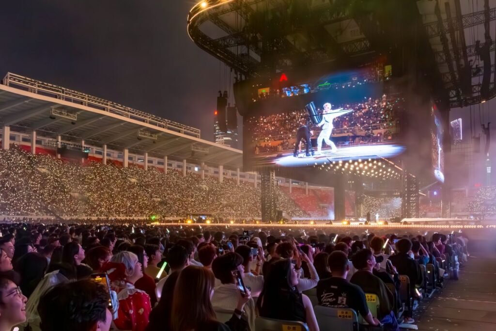 The Joker tour featured a four-sided stage that Chinese media billed as the largest ever built for a concert: 93 metres wide, 53 metres deep and rising 36 metres into the air