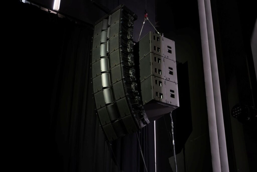 The main system centres on two hangs of eight K3 per side with four KS28 per side, flown alongside the main arrays rather than ground-stacked