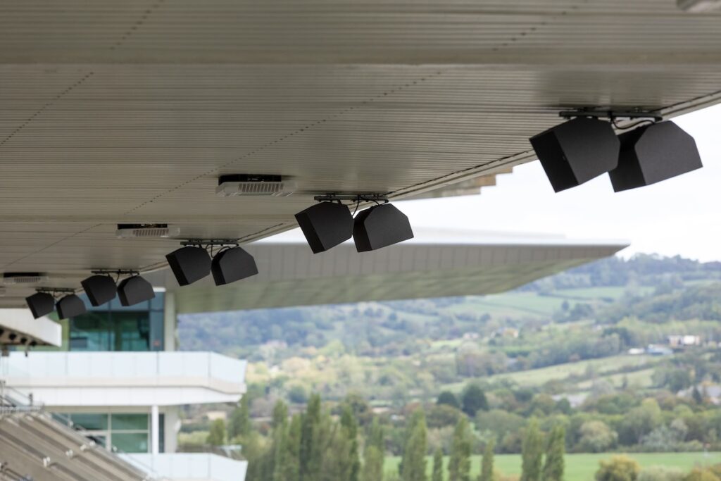 Fifty-four L-Acoustics X8i loudspeakers cover the tiered seats, steppings, and act as front-fill between the main arrays at Cheltenham Racecourse