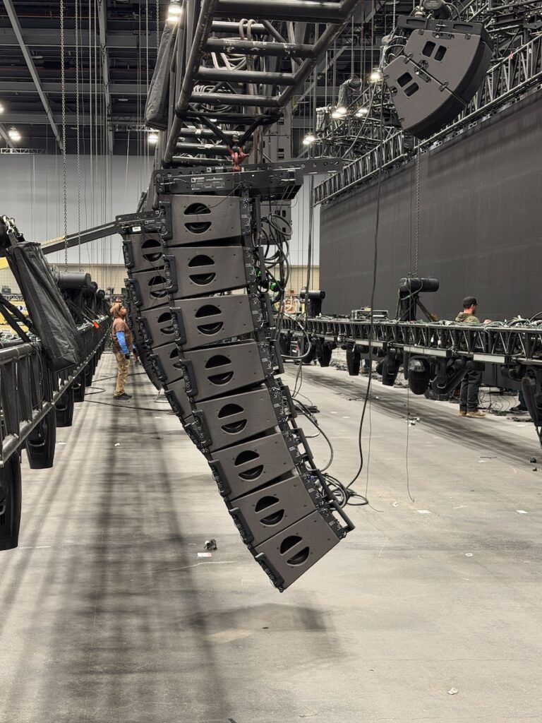 A side view of NMR Events’ L-Acoustics Kara II Scene system, KS28 subs, and A15 Wide stage-fills during the production’s setup