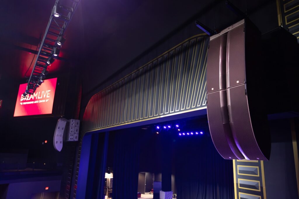 The room’s main L-Acoustics L2/L2D arrays are each backed by three flown KS28 subs