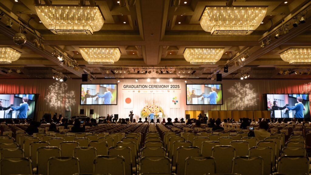 Around 1,400 students, families and staff gathered in The Club Fuji, which measures 32.0 metres deep by 50.5 metres wide beneath a 6.2-metre ceiling