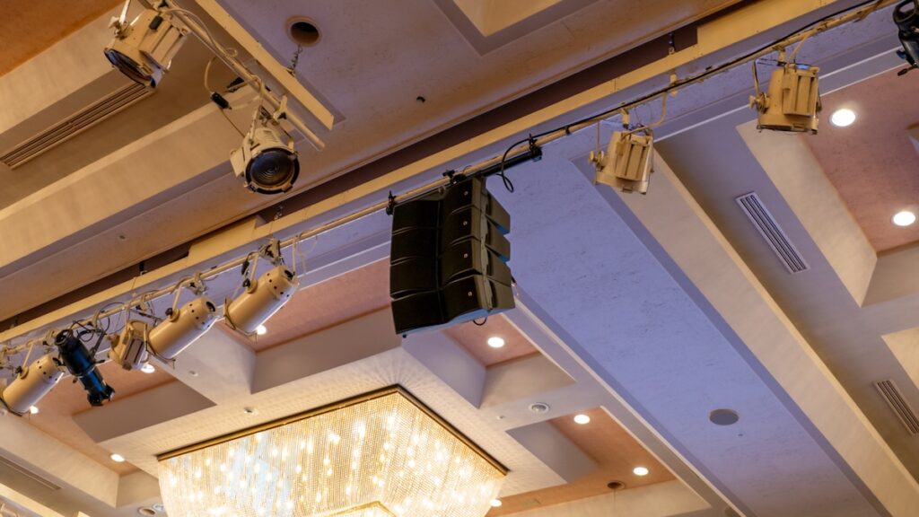 With no floor space to stack anything, Sonic Wave flies lightweight L-Acoustics in-fill from the ballroom's overhead battens to keep the sound even across the centre of the room