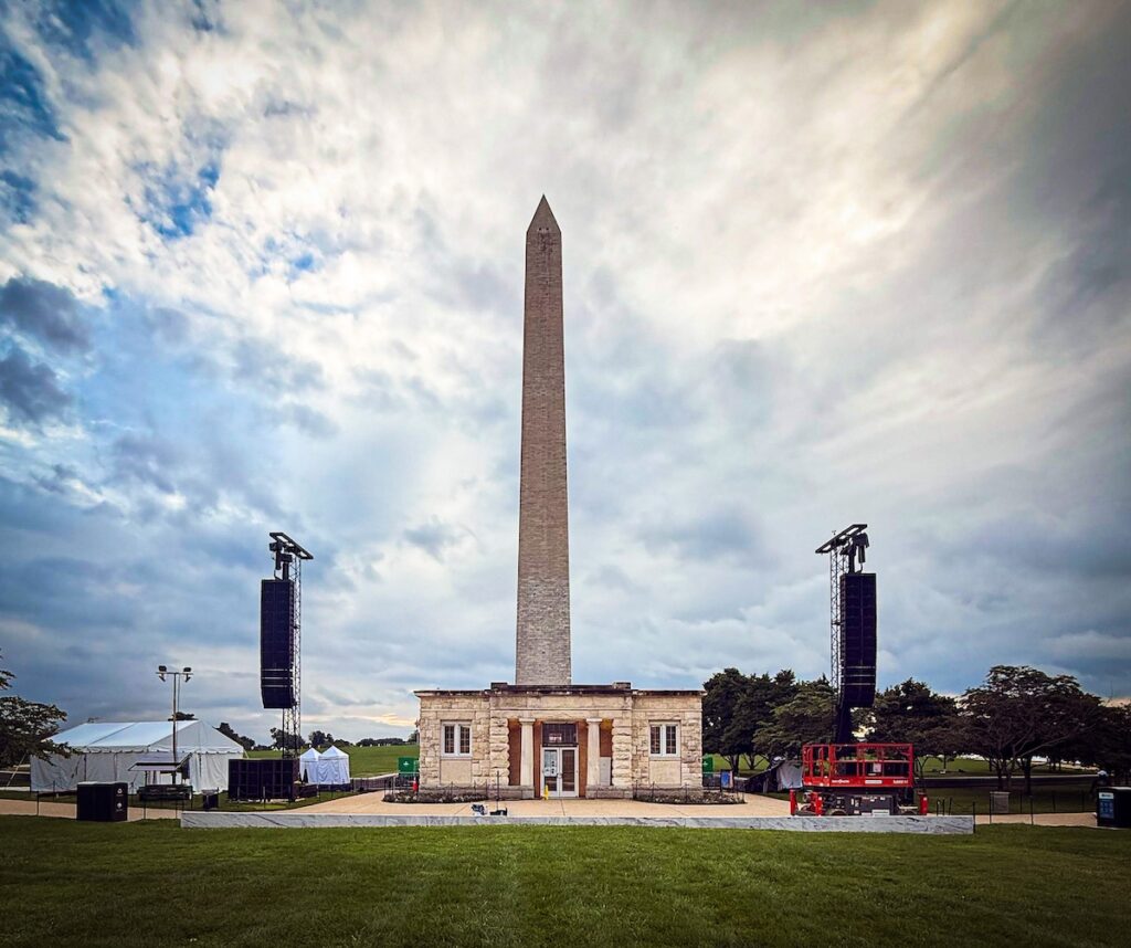 A view of the left and right Mall East L-Acoustics main arrays and subs flanking the Washington Monument Lodge